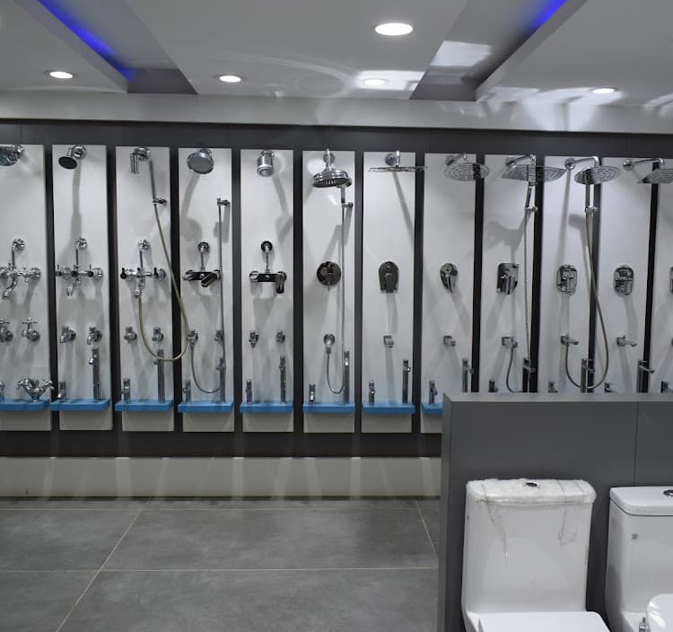 Rows of chrome showers and mixers on display panels